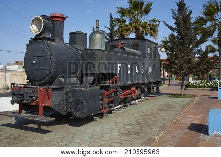 MEJILLONES, ANTOFAGASTA REGION, CHILE - SEPTEMBER 1, 2017: Historic steam engine in the coastal city of Mejillones in the Antofagasta Region of Chile