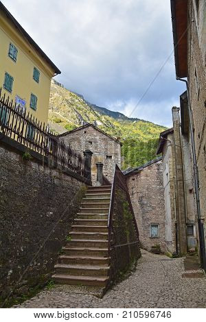 A small street in the hill village of Casso in Friuli Venezia Giulia north east Italy. With a population now of only 35 the village is famous locally for having being evacuated following the 1963 Vajont Dam disaster.