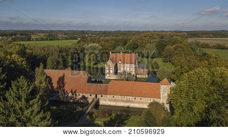 Aerial view of Hulshoff moated castle in North-Rhine Westphalia, Germany