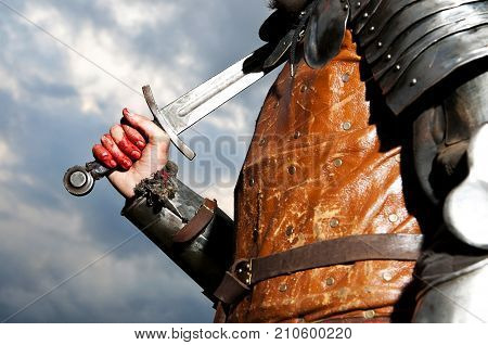 Knight Holding Sword On A Sky Background