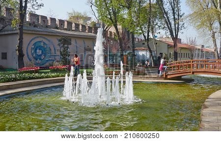 Istanbul Turkey - April 06 2016 Annual Spring Festival of Tulips new design Gulhane Park local people and tourists are getting rest making photos and enjoy good weather and spring slice of life editorial.