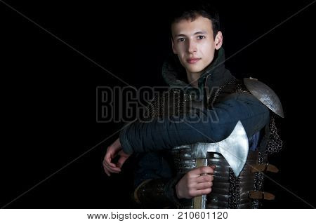 Young warrior with axe. Before battle. Medieval