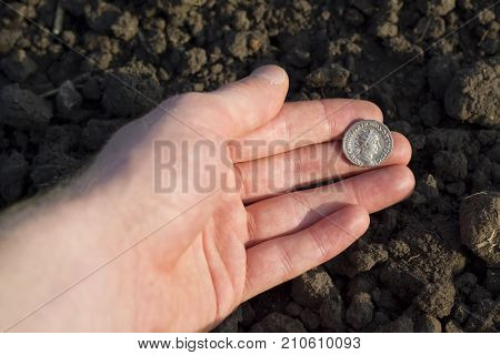 Hand Holding Roman Denarius (roman Silver Coin)