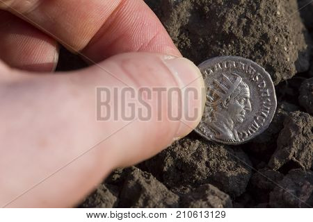 Hand Holding Roman Denarius (roman Silver Coin)