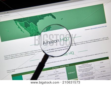 MONTREAL CANADA - OCTOBER 24 2017: Amazon second headquarter description and map on official website under magnifying glass. Amazon HQ2 will be Amazon's second headquarters in North America.