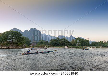 Vang Vieng, Laos - November 2015: Boat Service For Tourists In Nam Song River, Vang Vieng, Lao Pdr.