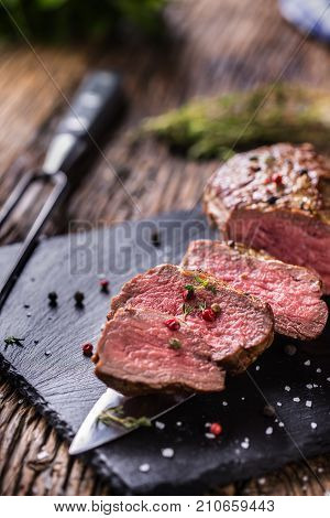 Beef Steak. Roasted Beef Steak With Salt Pepper Thyme On Rustic Wooden Table