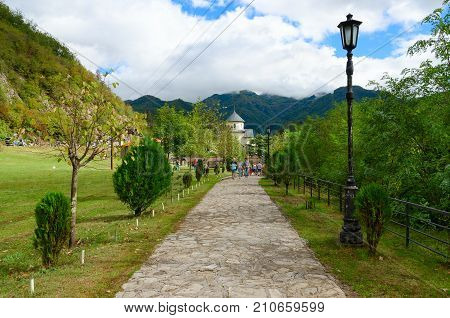 MONASTERY OF MORACA MONTENEGRO - SEPTEMBER 12 2017: Unknown tourists are walking along road to monastery of Moraca Montenegro
