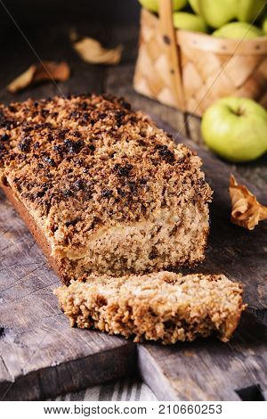 Homemade oatmeal apple cake crumbs on top on vintage rustic wooden background. Flourless, healthy dessert. Thanksgiving Day's dessert treat. Selective focus