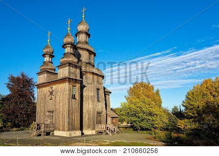 Old wooden church, standing in the autumn park Ukraine