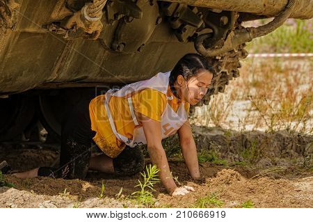 Girl Moves Under Tank In Extreme Race. Tyumen