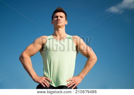 Athlete In Green Tshirt On Sunny Day