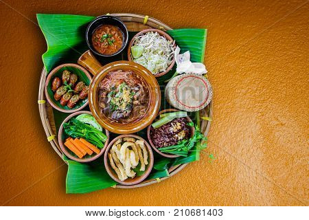 Tradition Northern Thai food. Thai cuisine chili sauce Thai sausages deep fried pork skin Steamed whole grain traditional. Thai food concept