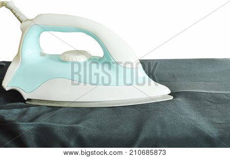 blue automatic electric iron pressing black slacks on ironing board