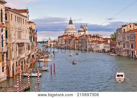 View from the Academy Bridge to the Grand Canal, Palazzo and the Cathedral of Santa Maria della Salute. Venice. Italy
