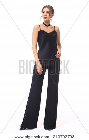 ffashion business woman in black straps silk top with laces flared trousers stiletto high heel shoes full body photo isolated on white