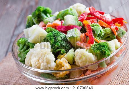 Mix of frozen vegetables in glass bowl