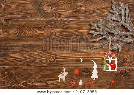 christmas tree with toys on a wooden background.