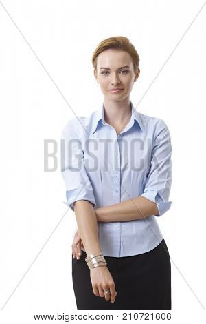Portrait of smiling attractive businesswoman, looking at camera.