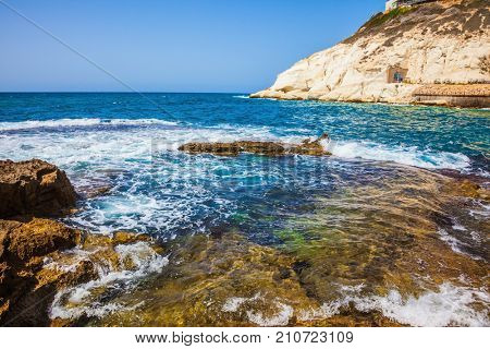 The north of Israel. The grottoes of Rosh Ha Nikra. Geological phenomenon on the border with Lebanon on the Mediterranean coast. Rocks of white limestone form caves, arches and grottoes