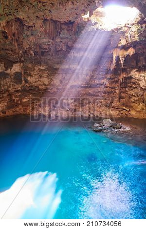 Cenote Samula sinkhole light beam near Valladolid in Yucatan Mexico