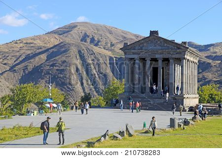 GARNI, ARMENIA - OCTOBER 1, 2016: Tourists at Ancient hellenistic Garni pagan Temple in Armenia