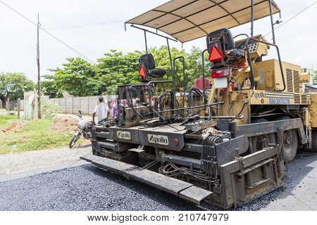 PONDICHERY PUDUCHERY INDIA - SEPTEMBER 05 2017. Unidentified workers works on a road construction industry and teamwork