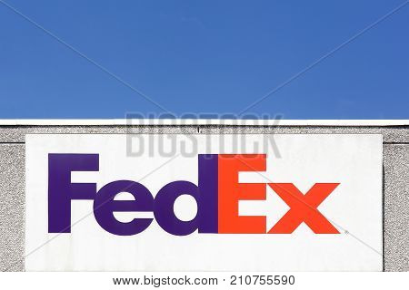 Kolding, Denmark - July 9, 2017: FedEx sign on a wall. FedEx Corporation is an American global courier delivery services company headquartered in Memphis, Tennessee