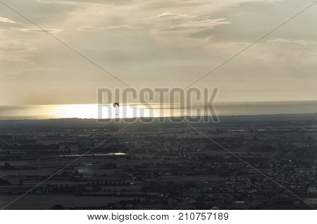 View of a paraglider at the sunset