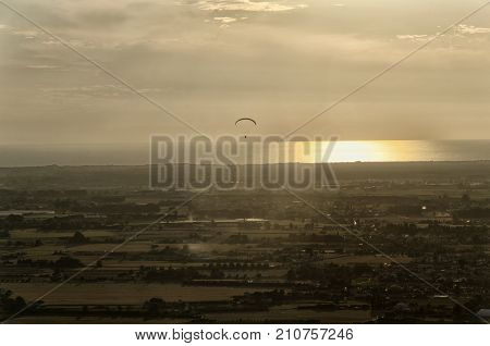 View of a paraglider above the sea