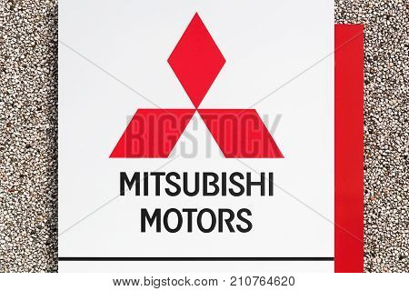 Skanderborg, Denmark - October 21, 2017: Mitsubishi logo on a wall. Mitsubishi Motors Corporation is a multinational automotive manufacturer headquartered in Tokyo, Japan