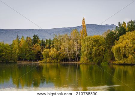 Autumn Colors And Reflection On The Puigcerda's Pond Water