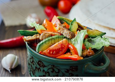 Vegetarian variant of mexican fachitos on wooden board.