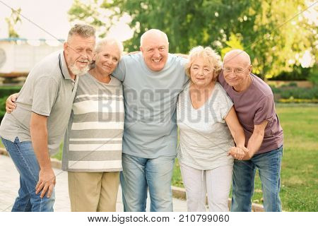 Group of elderly people resting in park
