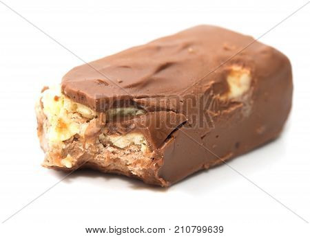 bitten off chocolate on white background Photos in the studio