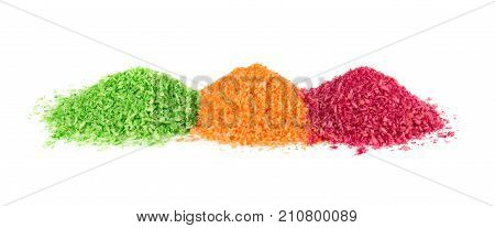 Heap of shredded coconut meat on white background. Multicolored dyed shredded coconut.