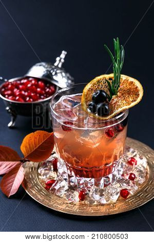 Fresh vodka and pomegranate and orange juice coctail, closeview.