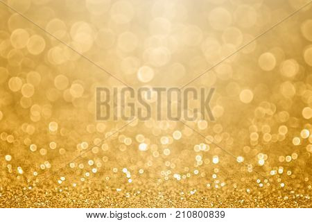 Abstract gold glitter sparkle confetti background or golden texture party invite for 50 wedding anniversary, new year's eve, happy birthday, falling coins or Christmas celebration