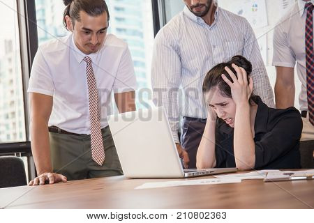 Stressful Business Young Woman With Her Hands On Her Head In Front Of Her Laptop. Business Team Stre