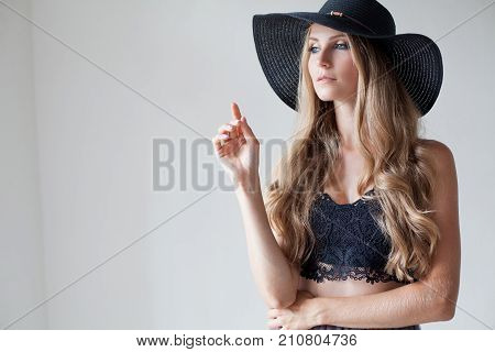 Fashionable Girl In A Hat With A Brim Poses For Advertising 1