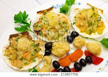Appetizer with capasanta and vegetables tasy view