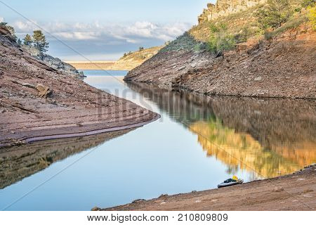 quiet afternoon on a mountain lake with a stand up paddleboard - Horsetooth Reservoir near Fort Collins, northern Colorado