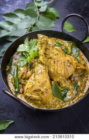 Traditional Indian curry chicken as close-up in a Korai 