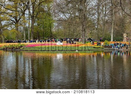 LISSE NETHERLANDS - APRIL 19 2017: Visitors at the Keukenhof Garden in Lisse Holland Netherlands.