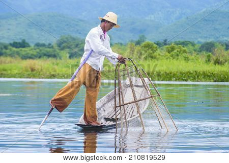 INLE LAKE MYANMAR - SEP 07 : Burmese fisherman at Inle lake Myanmar on September 07 2017 inle Lake is a freshwater lake located in Shan state