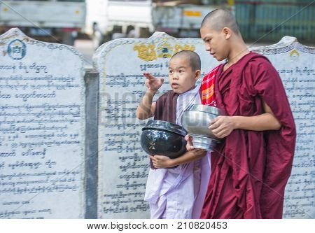 AMARAPURA MYANMAR - SEP 03 : Monks at the Mahagandayon Monastery in Amarapura Myanmaron September 03 2017 Mahagandayon Monastery has 2000 monks at any given time.