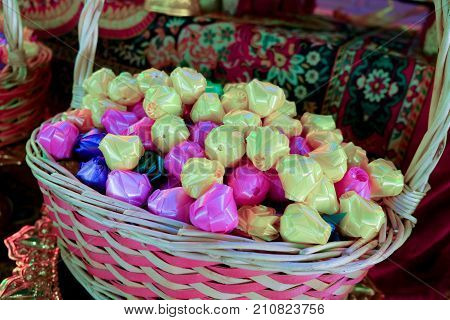 Wrap coins by hand for the sacred (ordination matriculation initiation) in Thailand