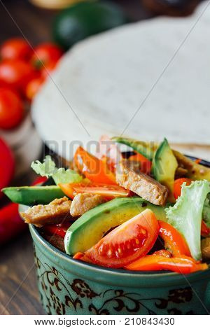 Vegetarian variant of mexican fachitos on wooden board.