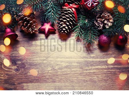 Christmas composition with holiday decoration on dark wooden board in vintage style with copy space. Flat lay top view