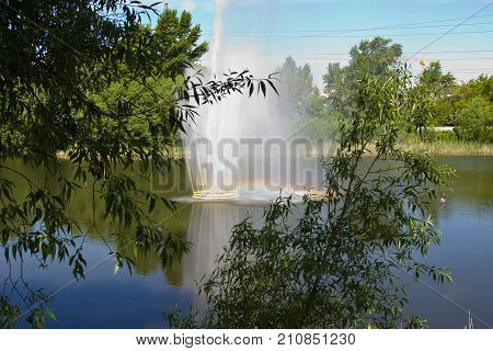 Fountain On The River In The Summer. The River Sviyaga, Ulyanovsk, Russia.